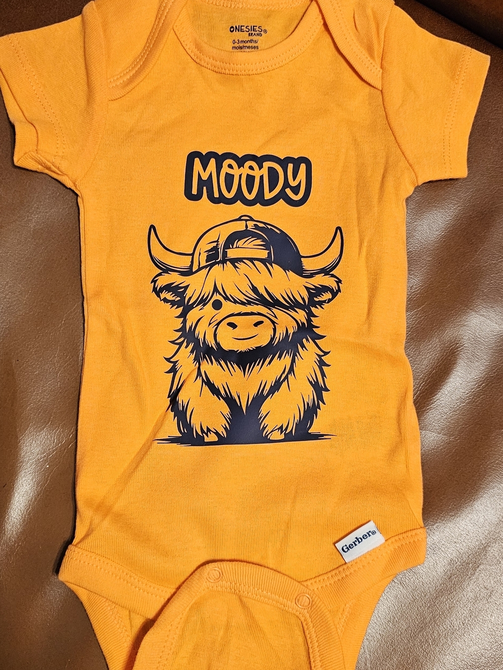 Gerber Orange Baby Onesie with Navy Highland Cow Graphic